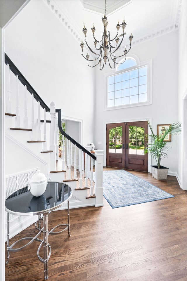 5313 Curlybark Pl, Brentwood, TN 37027 - entrance foyer with stairway, a towering ceiling, crown molding, a chandelier, and wood finished floors