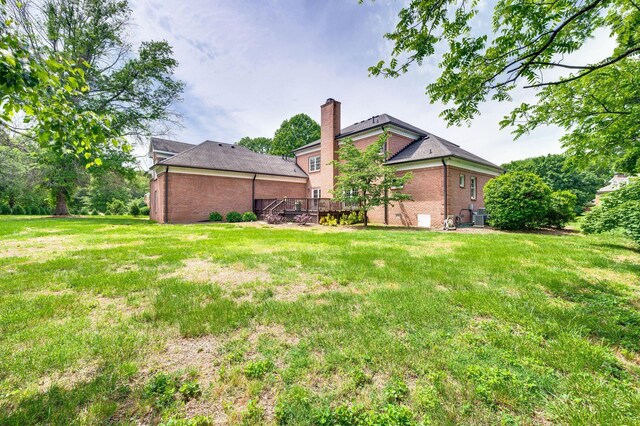 5313 Curlybark Pl, Brentwood, TN 37027 - view of grassy yard featuring a wooden deck and central AC unit