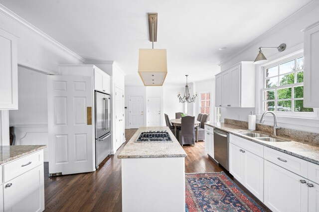 5313 Curlybark Pl, Brentwood, TN 37027 - kitchen with a sink, appliances with stainless steel finishes, a center island, dark wood-style floors, and a chandelier