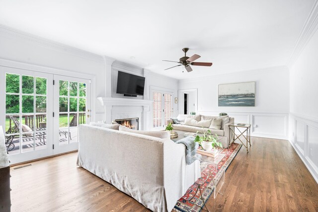 5313 Curlybark Pl, Brentwood, TN 37027 - living room featuring healthy amount of natural light, ornamental molding, ceiling fan, a glass covered fireplace, and wood finished floors
