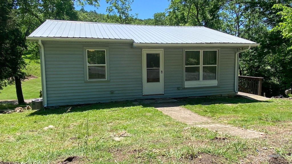 8324 River Road Pike, Nashville, TN 37209 - bungalow-style house featuring a front lawn, metal roof, and central air condition unit