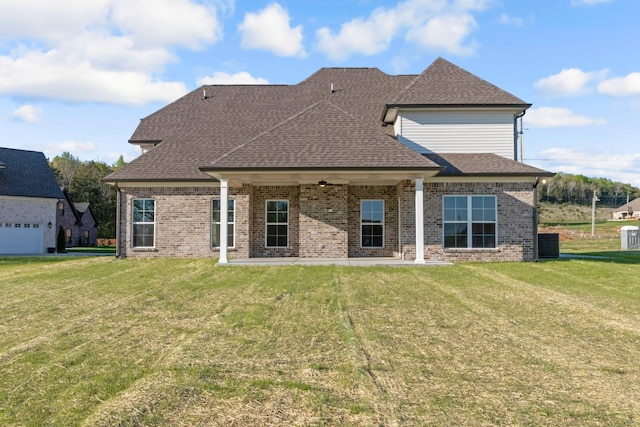 110 Canter Rd, Lascassas, TN 37085 - rear view of property with brick siding, a lawn, and roof with shingles