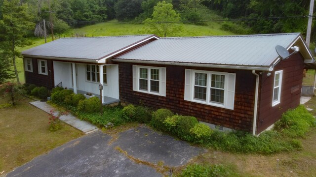 9073 Sherwood Rd, Sherwood, TN 37376 - ranch-style home with metal roof and a forest view
