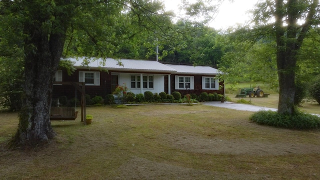 9073 Sherwood Rd, Sherwood, TN 37376 - ranch-style home with a front yard and metal roof