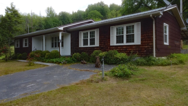9073 Sherwood Rd, Sherwood, TN 37376 - ranch-style house with a front lawn and metal roof