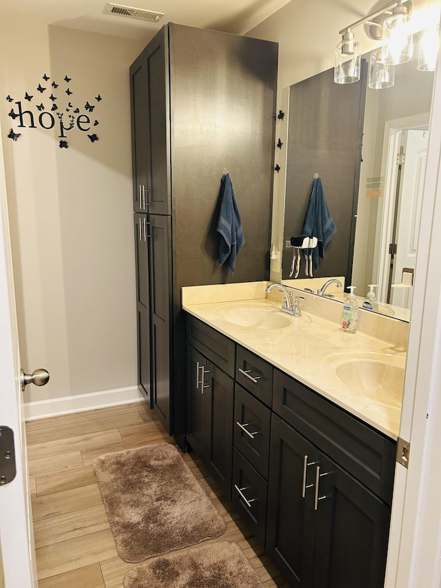 967 Horse Mountain Rd # 2-D, Shelbyville, TN 37160 - full bathroom featuring wood finished floors, double vanity, and baseboards