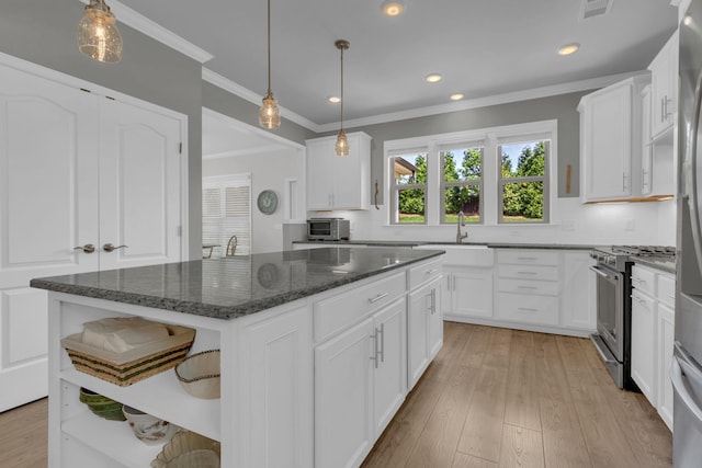1753 Humphreys Gln, Spring Hill, TN 37174 - kitchen with a sink, open shelves, gas range, a kitchen island, and white cabinets