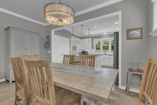 1753 Humphreys Gln, Spring Hill, TN 37174 - dining area with light wood-style floors, baseboards, a chandelier, crown molding, and recessed lighting