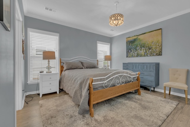 1753 Humphreys Gln, Spring Hill, TN 37174 - bedroom featuring crown molding, a chandelier, wood finished floors, and baseboards
