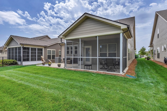 1753 Humphreys Gln, Spring Hill, TN 37174 - rear view of property featuring a sunroom, central air condition unit, a lawn, and a patio area