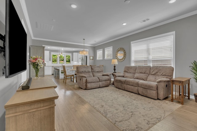 1753 Humphreys Gln, Spring Hill, TN 37174 - living room with crown molding, light wood finished floors, recessed lighting, and baseboards