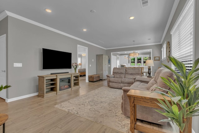 1753 Humphreys Gln, Spring Hill, TN 37174 - living area with wood finished floors, baseboards, recessed lighting, and ornamental molding