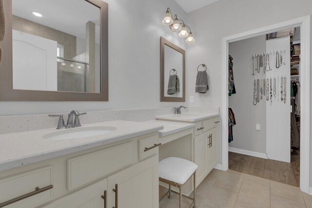 1753 Humphreys Gln, Spring Hill, TN 37174 - full bathroom with a walk in closet, a stall shower, double vanity, and tile patterned floors