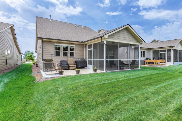 1753 Humphreys Gln, Spring Hill, TN 37174 - rear view of property with a sunroom, a patio, a lawn, and a shingled roof