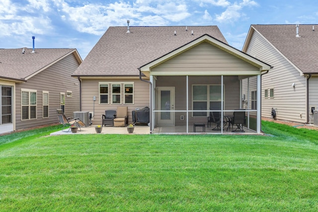 1753 Humphreys Gln, Spring Hill, TN 37174 - rear view of house featuring a sunroom, a patio area, a yard, central AC, and a shingled roof