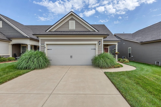 1753 Humphreys Gln, Spring Hill, TN 37174 - view of front of home featuring driveway, an attached garage, a front yard, and a shingled roof