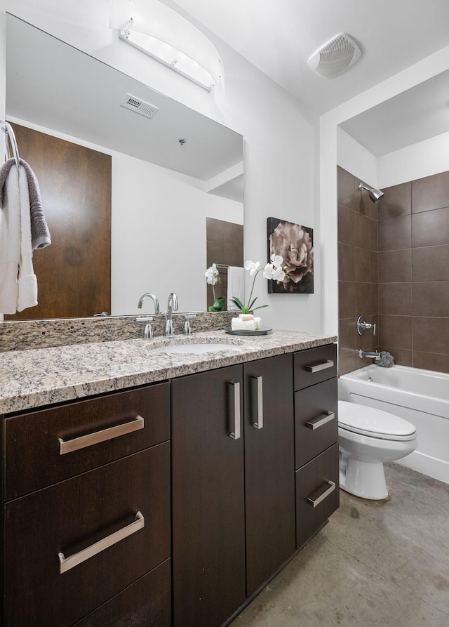 1510 Demonbreun St Unit 712, Nashville, TN 37203 - bathroom with concrete floors, toilet, vanity, and shower / tub combination