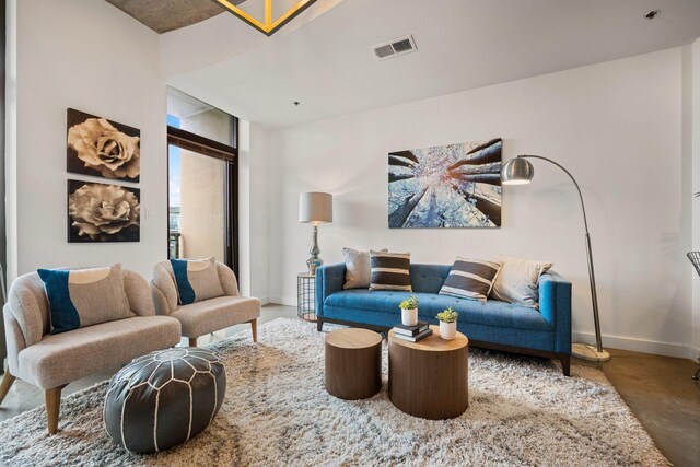 1510 Demonbreun St Unit 712, Nashville, TN 37203 - living room with concrete floors and baseboards