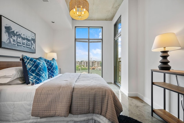 1510 Demonbreun St Unit 712, Nashville, TN 37203 - bedroom featuring a chandelier, baseboards, and access to exterior