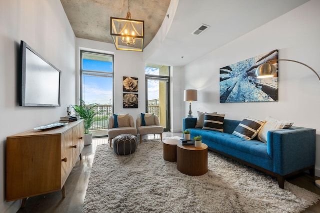 1510 Demonbreun St Unit 712, Nashville, TN 37203 - living room with a chandelier and wood finished floors