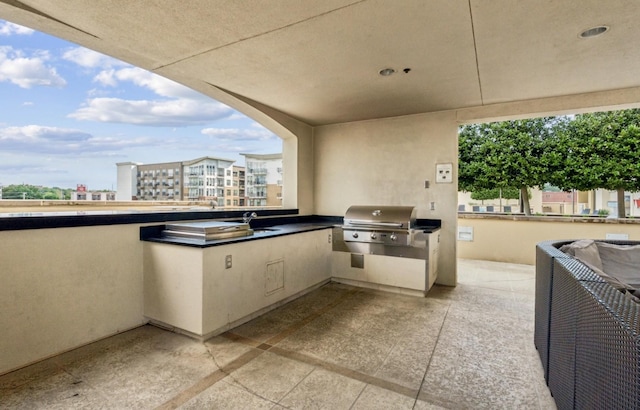 1510 Demonbreun St Unit 712, Nashville, TN 37203 - view of patio / terrace with grilling area, an outdoor kitchen, and a sink