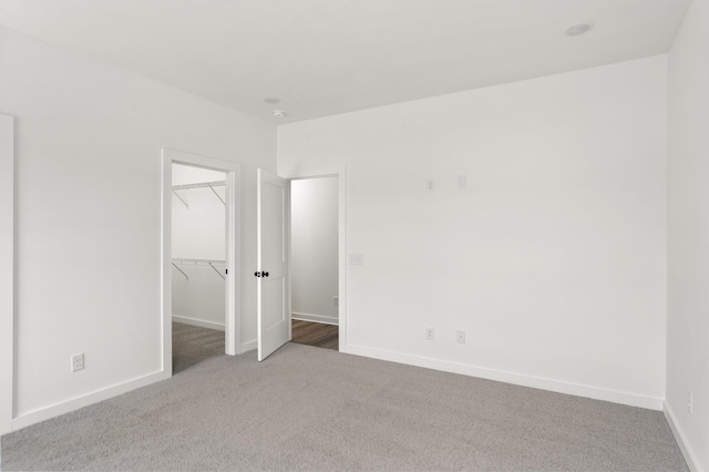 2384 Nelson Way, Cookeville, TN 38506 - unfurnished bedroom featuring carpet, a spacious closet, baseboards, and a closet