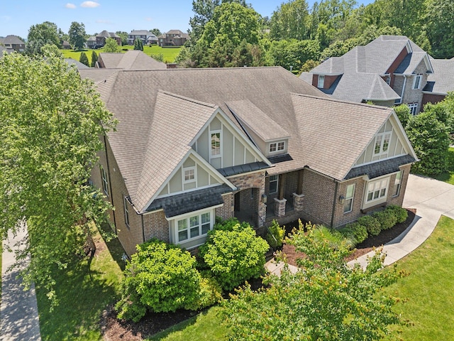 4101 Owen Watkins Ct, Franklin, TN 37067 - view of front facade with stone siding, a shingled roof, a residential view, and concrete driveway