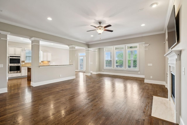 4101 Owen Watkins Ct, Franklin, TN 37067 - unfurnished living room featuring ceiling fan, dark wood-style floors, ornate columns, a fireplace, and baseboards