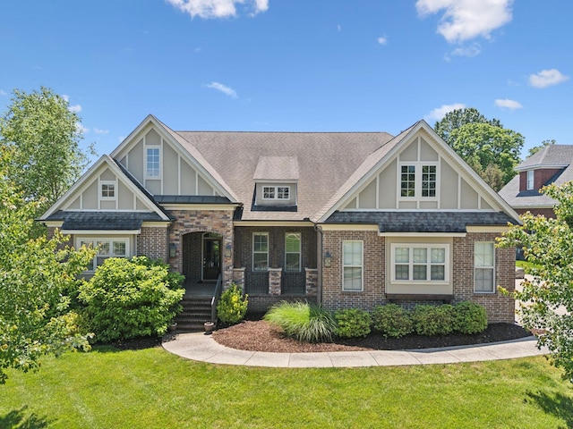 4101 Owen Watkins Ct, Franklin, TN 37067 - view of front of property with a front lawn, brick siding, roof with shingles, and board and batten siding