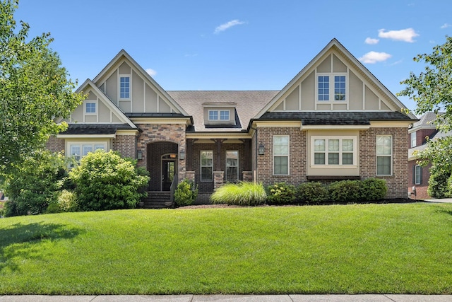 4101 Owen Watkins Ct, Franklin, TN 37067 - view of front of home with a front yard, board and batten siding, brick siding, and a shingled roof