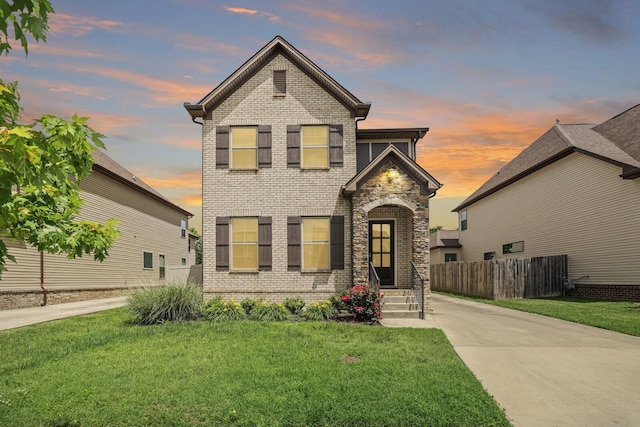 view of front of house with brick siding and driveway