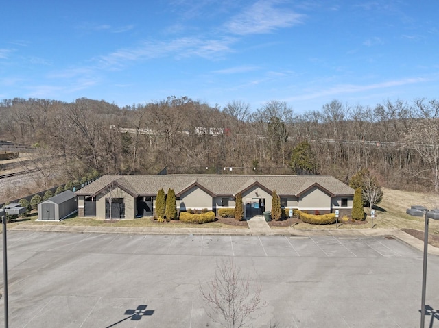 view from above of property featuring a forest