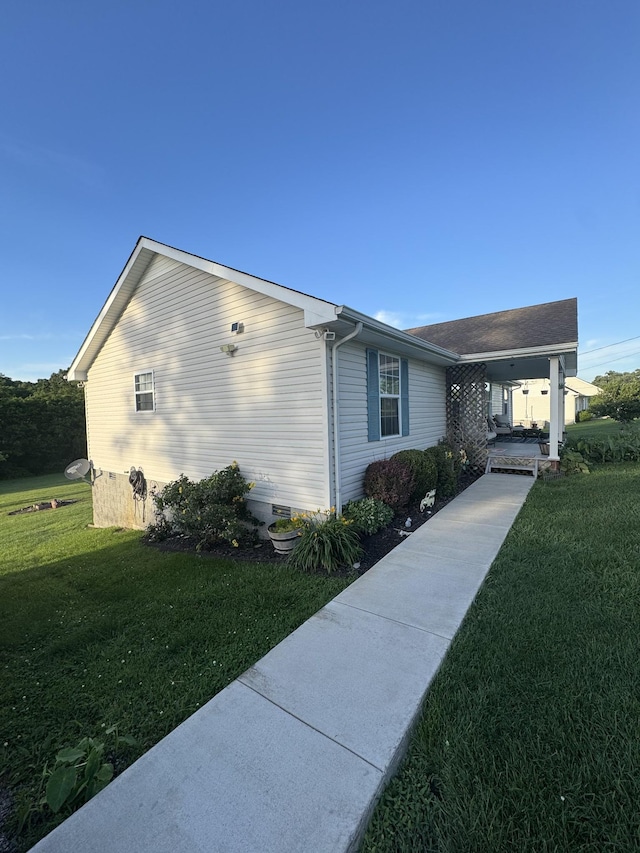 162 Pigeon Roost Rd, Brush Creek, TN 38547 - view of property exterior featuring a lawn and crawl space