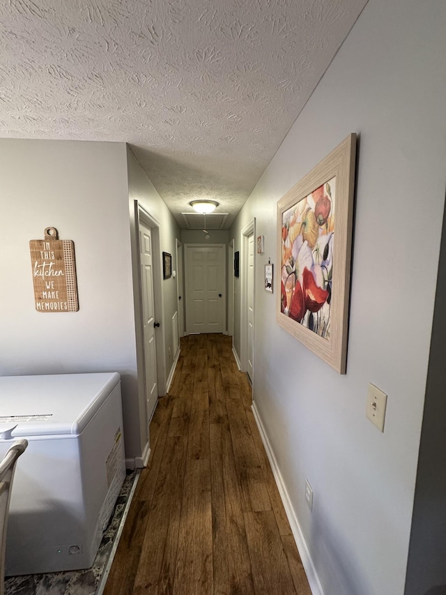 162 Pigeon Roost Rd, Brush Creek, TN 38547 - hallway featuring attic access, hardwood / wood-style flooring, a textured ceiling, and baseboards