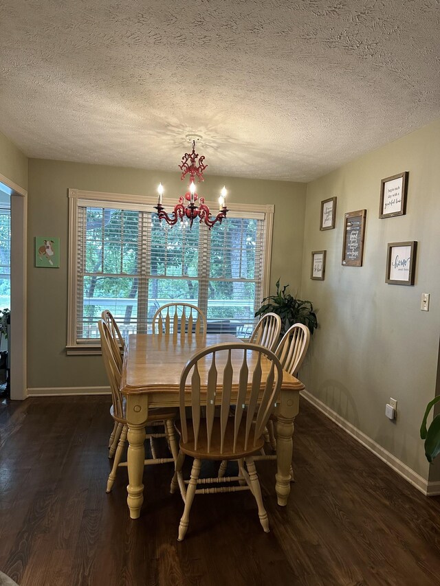 434 Hickman Shores Rd, Dover, TN 37058 - dining space featuring wood finished floors, healthy amount of natural light, baseboards, a textured ceiling, and a chandelier