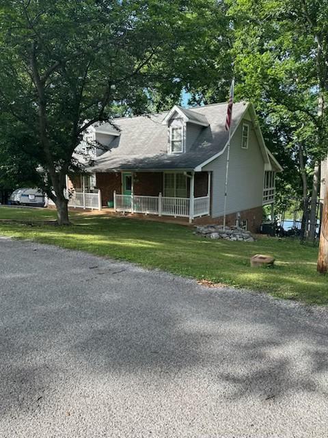 434 Hickman Shores Rd, Dover, TN 37058 - view of front facade featuring covered porch and a front yard