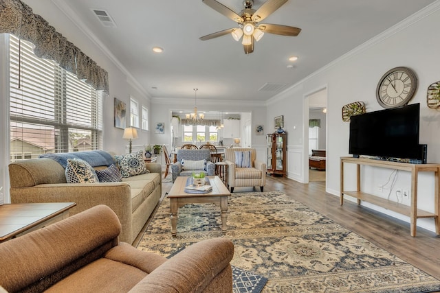 1514 Bledsoe Knl, Spring Hill, TN 37174 - living area with a chandelier, ceiling fan, crown molding, wood finished floors, and recessed lighting