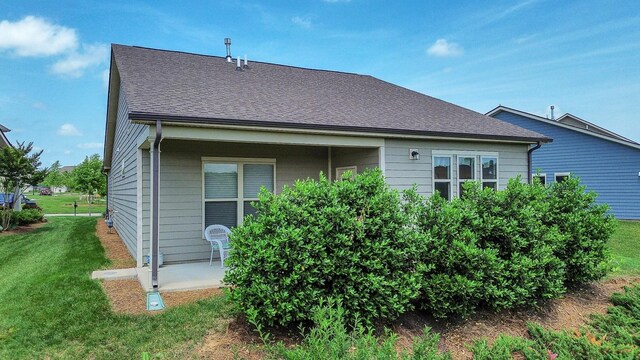 1514 Bledsoe Knl, Spring Hill, TN 37174 - rear view of house with a lawn, a patio, and a shingled roof