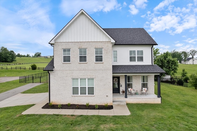 1412 Barrett Dr, Mount Juliet, TN 37122 - view of front facade with board and batten siding, brick siding, roof with shingles, and covered porch