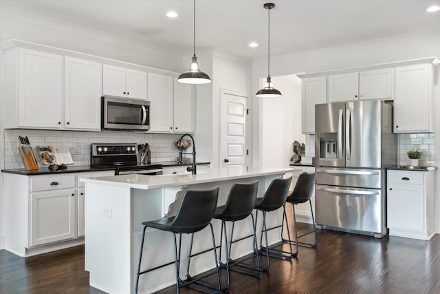 1412 Barrett Dr, Mount Juliet, TN 37122 - kitchen featuring stainless steel appliances, decorative backsplash, dark wood-style flooring, a center island with sink, and white cabinetry