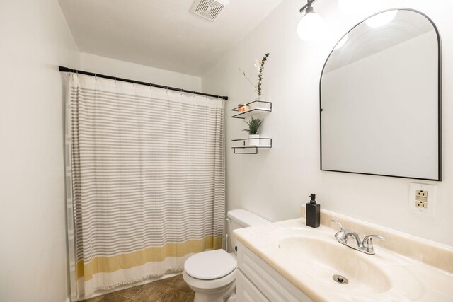 1114 Kingston Springs Rd, Kingston Springs, TN 37082 - full bath with toilet, vanity, and tile patterned floors