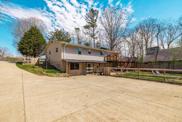 1114 Kingston Springs Rd, Kingston Springs, TN 37082 - rear view of house featuring a deck, fence, and a patio