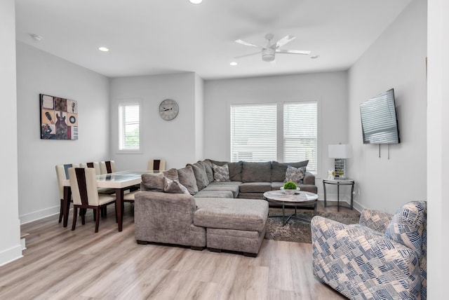 living area with light wood finished floors, recessed lighting, ceiling fan, and baseboards