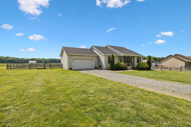 1014 Gill Hodges Rd, Portland, TN 37148 - ranch-style home with an attached garage, gravel driveway, and brick siding