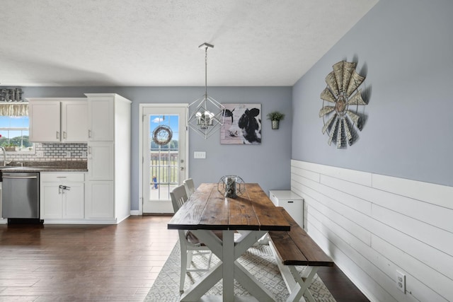 1014 Gill Hodges Rd, Portland, TN 37148 - dining area featuring a chandelier, plenty of natural light, dark wood-type flooring, and a textured ceiling