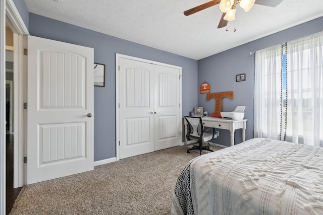 1014 Gill Hodges Rd, Portland, TN 37148 - carpeted bedroom with a closet, a ceiling fan, and a textured ceiling