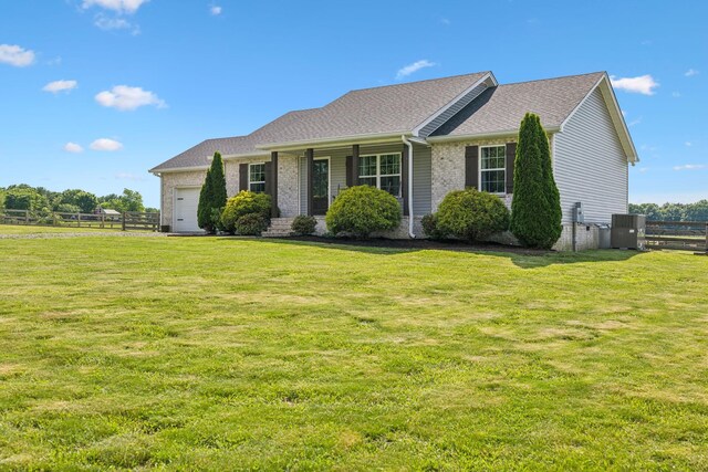 1014 Gill Hodges Rd, Portland, TN 37148 - ranch-style home with a garage, central AC, brick siding, and roof with shingles