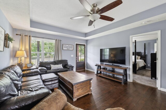 1014 Gill Hodges Rd, Portland, TN 37148 - living area featuring hardwood / wood-style flooring, a ceiling fan, baseboards, and a raised ceiling