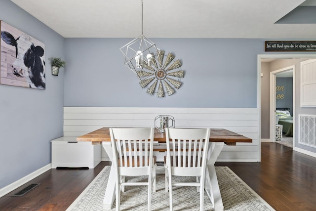 1014 Gill Hodges Rd, Portland, TN 37148 - dining room featuring wood-type flooring, a chandelier, baseboards, and wainscoting