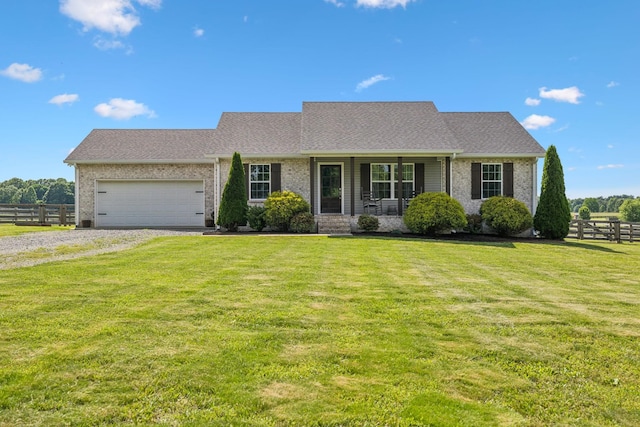 1014 Gill Hodges Rd, Portland, TN 37148 - view of front of home with an attached garage, gravel driveway, covered porch, brick siding, and a shingled roof